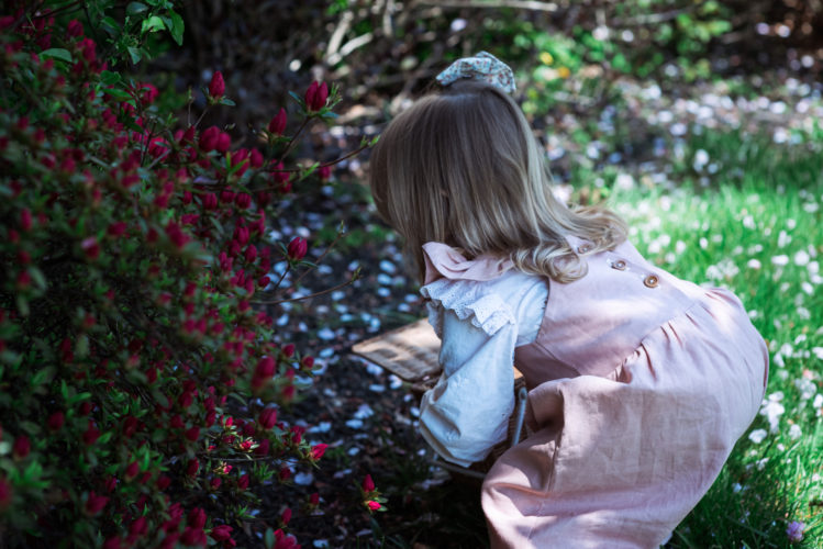 little girl picking flowers for floral salt dough craft